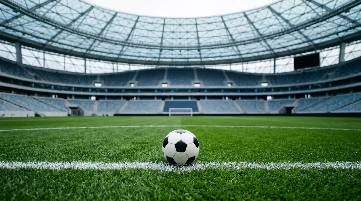 Joueurs suisses et bosniens disputant un duel aérien sous le toit translucide du SoFi Stadium d'Inglewood