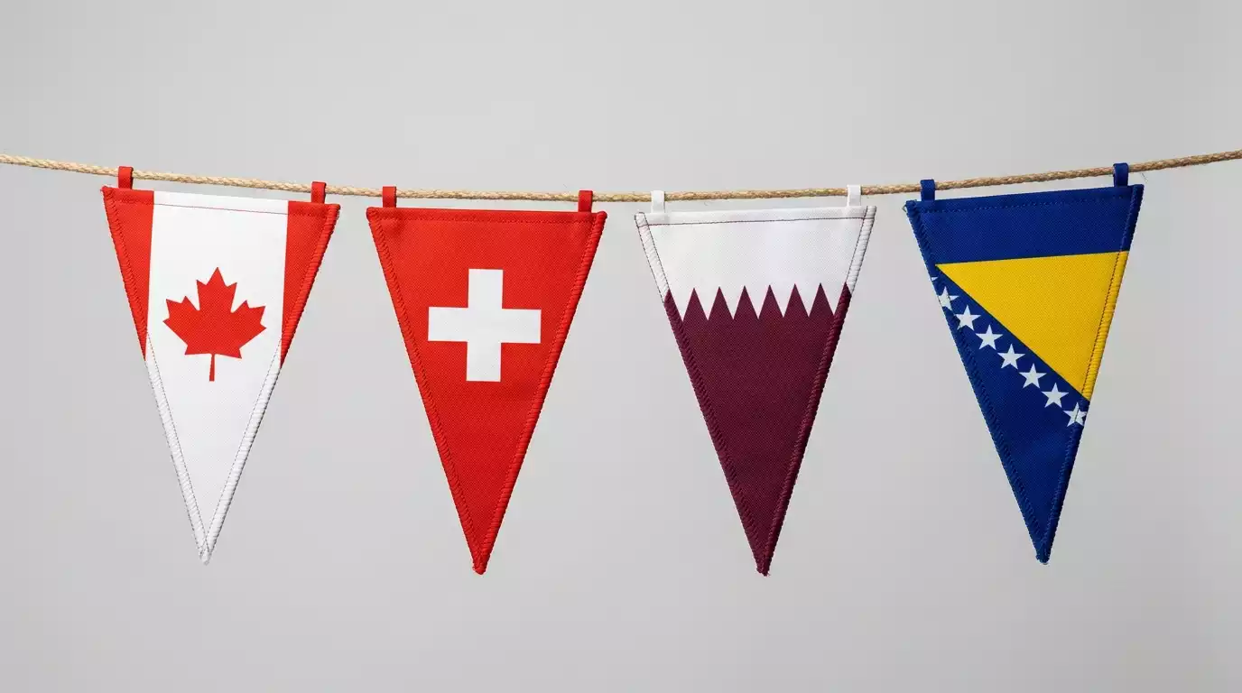 Drapeaux du Canada, de la Suisse, du Qatar et de la Bosnie-Herzégovine alignés avant le Mondial 2026